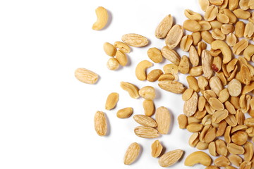 Mix of roasted and salted peanuts, cashew nuts, almonds and hazelnut isolated on white background, top view
