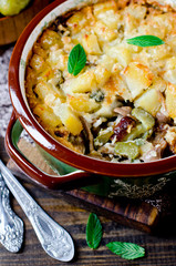 Potato casserole with meat, mushrooms and pickled cucumbers