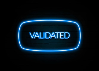 Validated  - colorful Neon Sign on brickwall