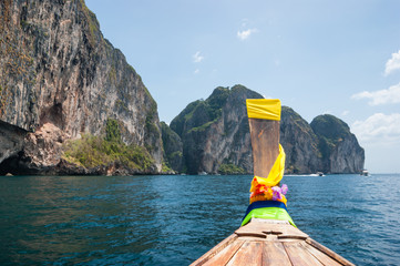 Traditional Thai Longtail boat and island of Phi Phi Leh on the horizon,Thailand