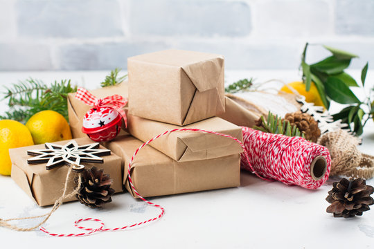 Many Christmas gift boxes. Christmas presents ready for wrapping with decor on white holiday background. Copy space