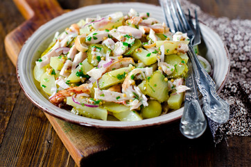 Potato salad with chicken and pickled cucumbers