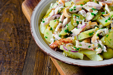 Potato salad with chicken and pickled cucumbers