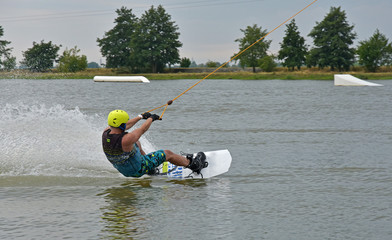 Athlete rides on water skis on water