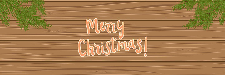 Christmas tree branches on a wooden background. top view. Christmas card. festive background.