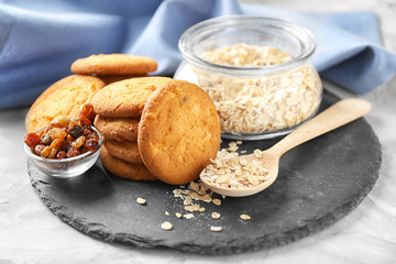 Delicious oatmeal cookies on slate plate