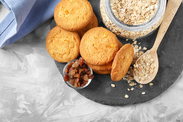 Delicious oatmeal cookies on slate plate