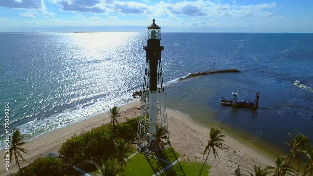 Wall mural Drone orbit shot Hillsboro Inlet Lighthouse Pompano Beach FL 4k 60p