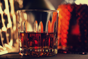 Glass of brandy on the wooden table 