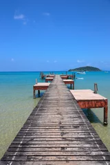 Fotobehang Old wooden pier on exotic beach island © arbalest