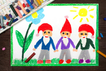 Obraz na płótnie Canvas Colorful drawing: three smiling dwarfs in red hats