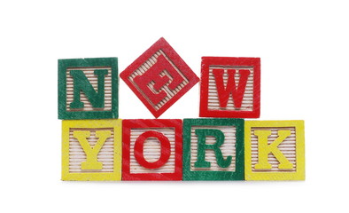 Alphabet blocks, letters spelling out city New York isolated on white background