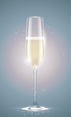 Transparent champagne glass with sparkling white wine. Faded retro vintage background. New Year or other event greeting card with sparks.