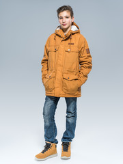 Fototapeta premium Teenage boy in winter clothes