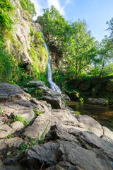 Naklejka premium Landscape of one of water cascades of Oneta waterfalls in picturesque forest of Asturias, Spain.