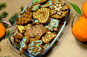 Homemade colourful christmass ginger cookies in christmas decoration, top view