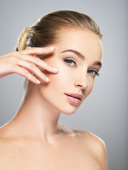 Beautiful face of young woman with perfect skin