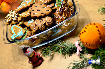 Homemade colourful christmass ginger cookies in christmas decoration, top view