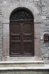 Gubbio, Perugia, Italy -  entrance door, architectural details of the ancient palaces