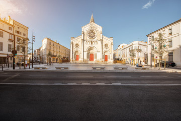 Obraz premium Street view on the saint Paul church during the sunny morning in Nimes in the Occitanie region of southern France