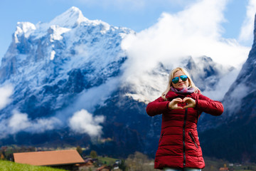 beautiful girl enjoying the sun, winter day in the mountains