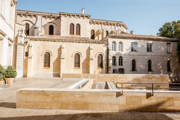 Morning view on the small square near the saint Castor cathedral in Nimes city in the Occitanie...