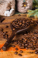 Dark roasted pure arabica coffee beans and ground coffe on the wooden table, copy space