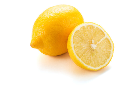 Yellow lemon citrus fruit with lemon fruit half isolated on white background
