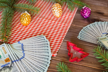 American dollars as a Christmas gif t or a Christmas spending concept