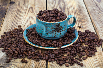 Cup full of coffee beans