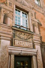 Beautiful Luxury Restaurant signage on the vintage painted building in Colmar, France