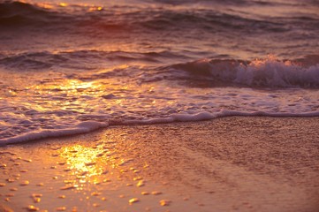 Fototapeta na wymiar Soft wave of sea at sunset