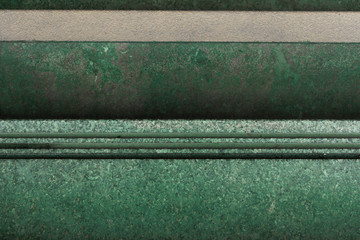 Top view of green gravel stairs. Abstract background texture