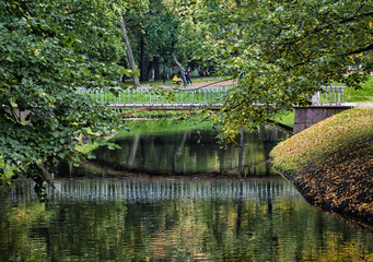 River and autumn trees in a quiet park.