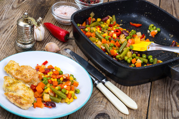 Stewed vegetables with pieces of meat in breading for dinner