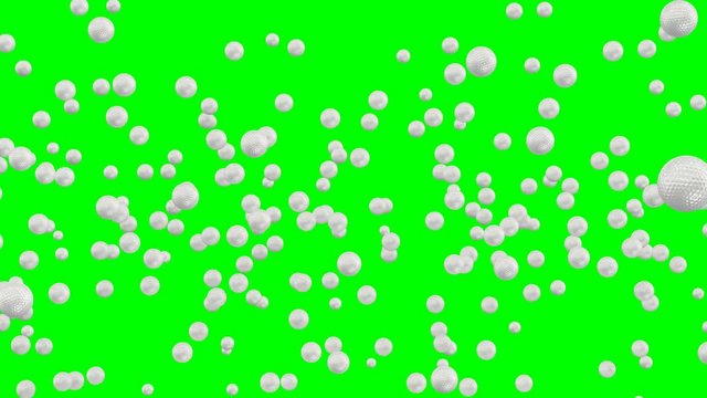 Animated a lot of plain white golf balls dancing, flying or jumping against green background and in slow motion. Front camera view.
