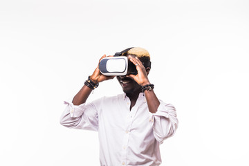 Isolated portrait of an African American young man in a hoodie wearing vr glasses and playing a video game.