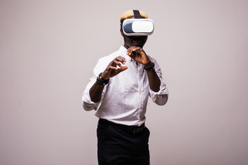 Fototapeta na wymiar African American young man wearing vr virtual reality headset over white background