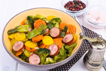 Vegetable stew with pieces of smoked sausage
