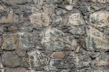 Background of old stone masonry texture close-up view