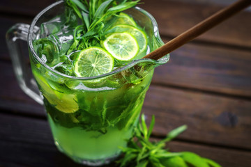 Homemade lemonade with tarragon in a jar close up