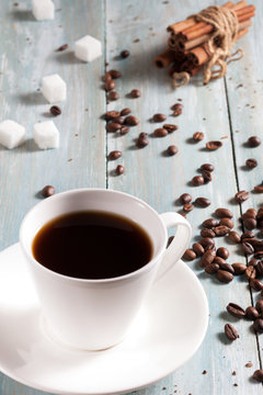 A cup of hot coffee with sugar and cinnamon