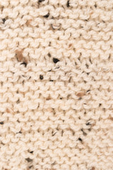 Winter Sweater Design. Bege knitting wool texture background. knitted fabric texture. Knitted jersey background with a relief pattern. Braids in knitting