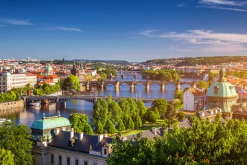 Poster Scenic spring sunset aerial view of the Old Town pier architecture and Charles Bridge over Vltava river in Prague, Czech Republic © daliu