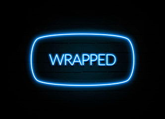Wrapped  - colorful Neon Sign on brickwall