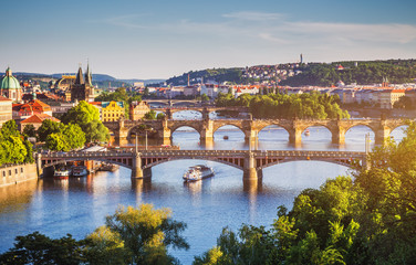 Charles Bridge (Karluv Most) and Lesser Town Tower, Prague in summer at sunset, Czech Republic - obrazy, fototapety, plakaty