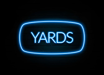 Yards  - colorful Neon Sign on brickwall