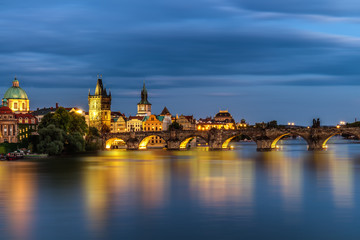 Fototapeta na wymiar View of the Vltava River and the bridges shined with the sunset sun, Prague, the Czech Republic