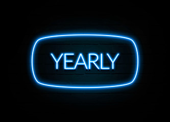 Yearly  - colorful Neon Sign on brickwall