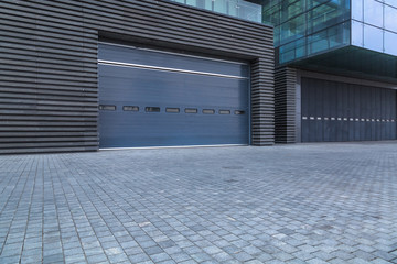 empty brick floor front of modern building